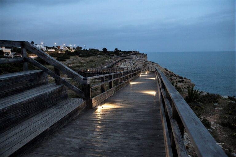 carvoeiro boardwalk at dusk lights algarve portugal
