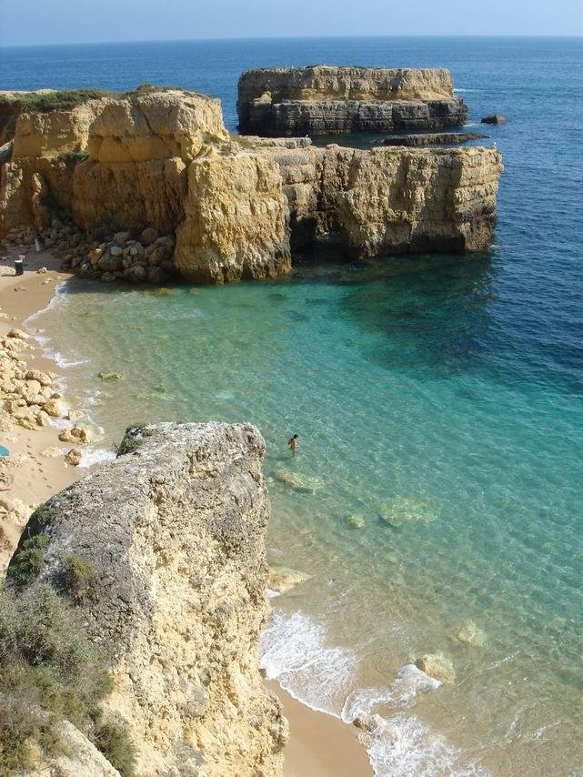 secluded beach cove with clear water carvoeiro algarve portugal