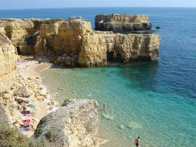 hidden beach between cliffs carvoeiro algarve portugal