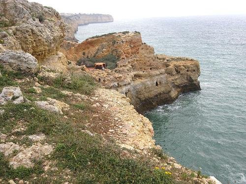 coastal inlet between cliffs carvoeiro algarve portugal