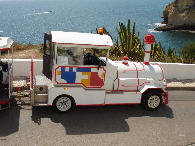 carvoeiro tourist train near beach and coastline algarve