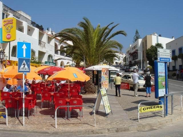 outdoor seating and palm trees in carvoeiro village portugal