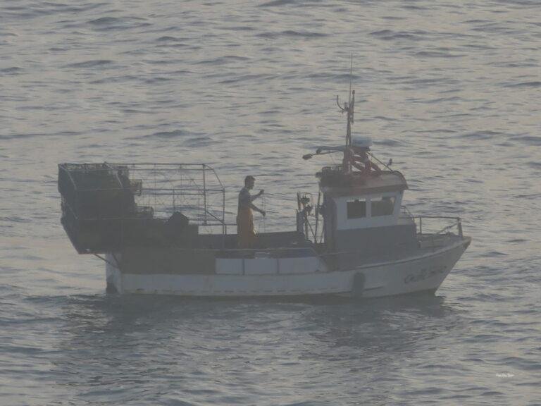 local fisherman boat on ocean near carvoeiro algarve portugal