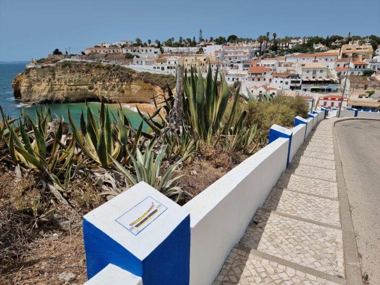 white houses on cliffs overlooking carvoeiro beach algarve portugal