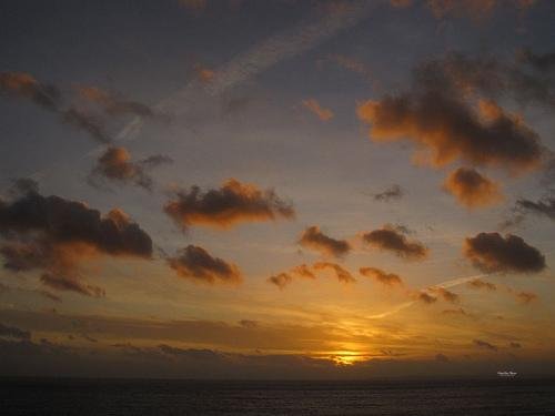 sunset clouds over carvoeiro coastline