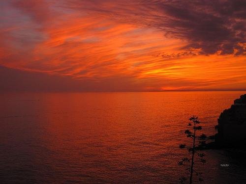 red sunset over atlantic ocean algarve
