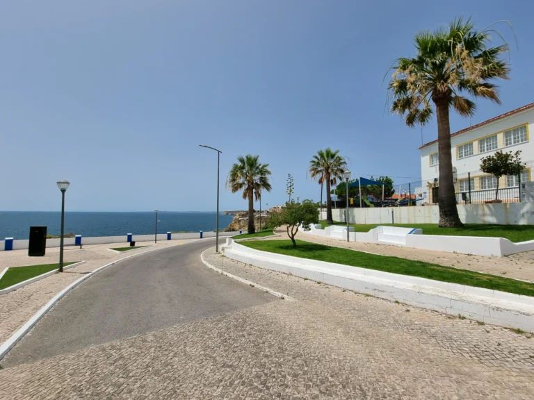 curved coastal road near ocean view terrace carvoeiro algarve portugal