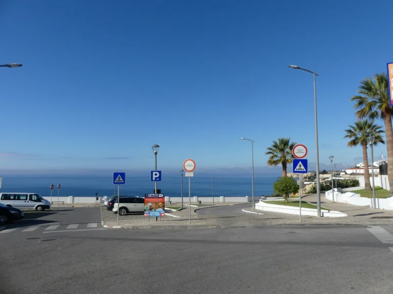 private road descending to ocean view terrace carvoeiro algarve portugal