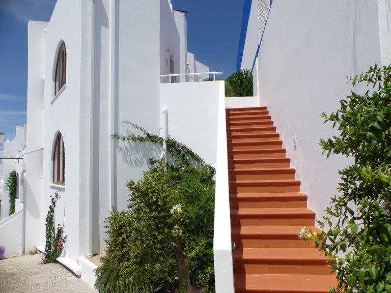 stairs leading down to ocean view terrace carvoeiro algarve portugal